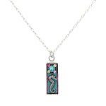 The Mini Seahorse Soft Necklace by Firefly features a delicate silver chain with a rectangular turquoise pendant adorned with a seahorse and colorful floral accents. Handmade in Guatemala by Firefly Jewelry.