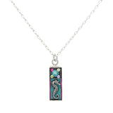 The Mini Seahorse Soft Necklace by Firefly features a delicate silver chain with a rectangular turquoise pendant adorned with a seahorse and colorful floral accents. Handmade in Guatemala by Firefly Jewelry.