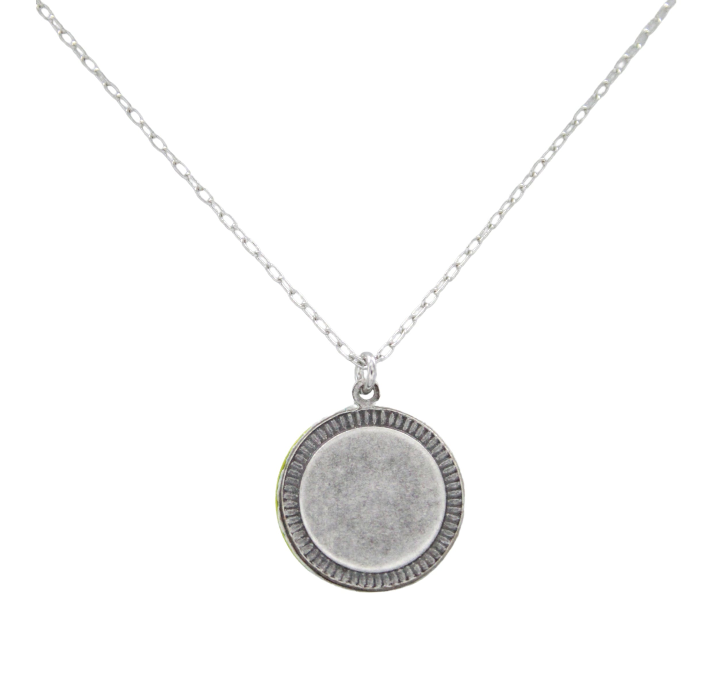 The Firefly Beach Glass Round Soft Necklace features a delicate silver chain and a textured round pendant, showcased on a plain white background.