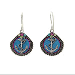 The Playa Anchor Soft Earrings by Firefly feature seashell and anchor designs with decorative accents on a blue background. Handmade in Guatemala, these fair-trade earrings from Firefly Jewelry add coastal charm to any outfit.