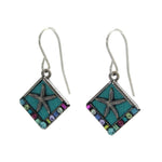The Playa Starfish Soft Earrings by Firefly are square-shaped dangle earrings, handmade in Guatemala with a teal background, silver starfish center, and multicolored edge accents on silver hooks—a unique fair-trade jewelry piece.