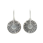 The Playa Sand Dollar Soft Earrings by Firefly are round, silver dangles with intricate embossed patterns and hooks—handmade jewelry from Firefly, perfect for any occasion.