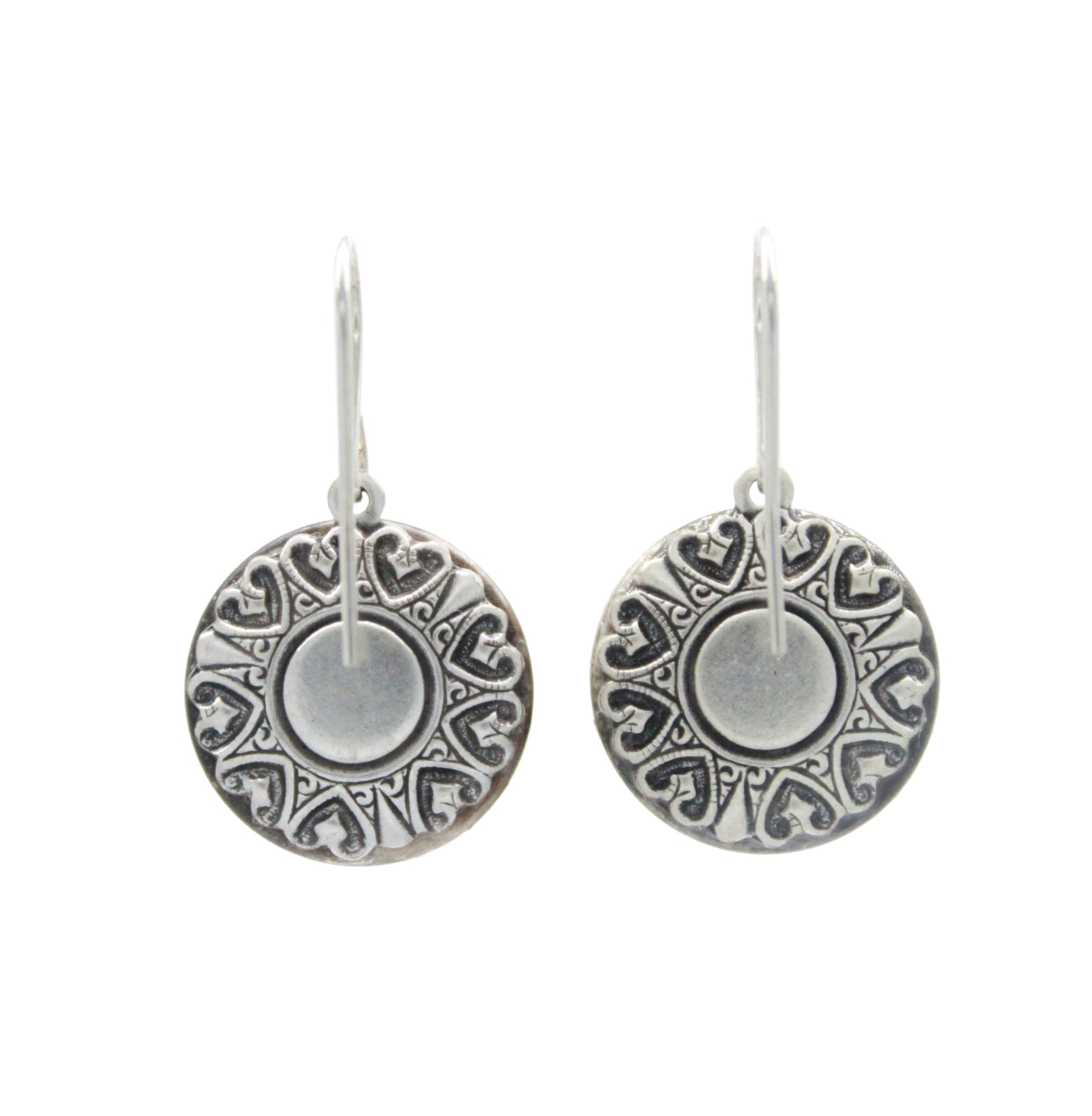 The Playa Sand Dollar Soft Earrings by Firefly are round, silver dangles with intricate embossed patterns and hooks—handmade jewelry from Firefly, perfect for any occasion.