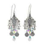 Firefly Beach Pearl Diamond Shell w/Fringe Soft Earrings feature ornate silver design, floral engravings, dangling seashell-shaped charms, colorful beads, and white pearl accents. Handmade by Firefly in Guatemala.
