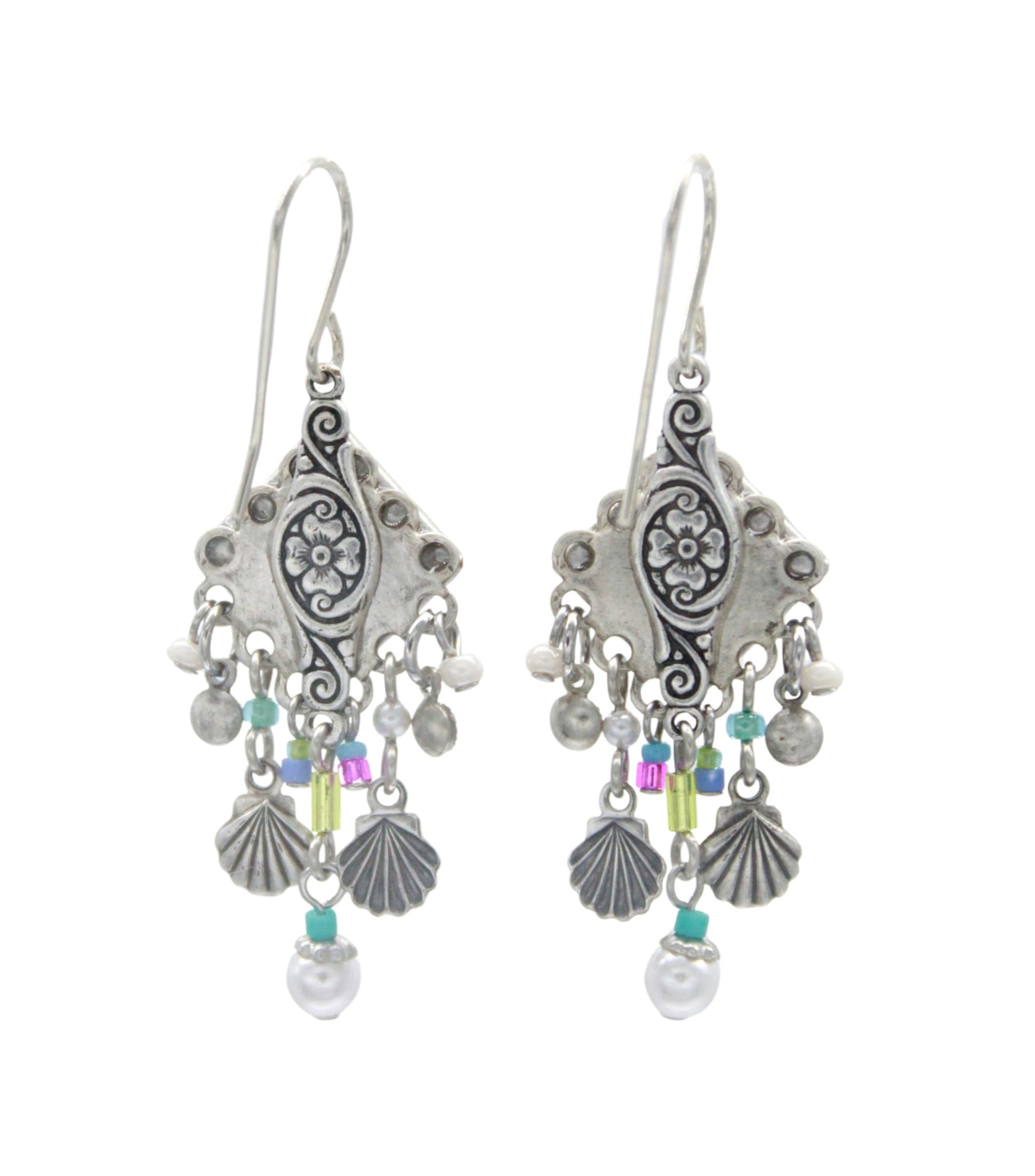 Firefly Beach Pearl Diamond Shell w/Fringe Soft Earrings feature ornate silver design, floral engravings, dangling seashell-shaped charms, colorful beads, and white pearl accents. Handmade by Firefly in Guatemala.