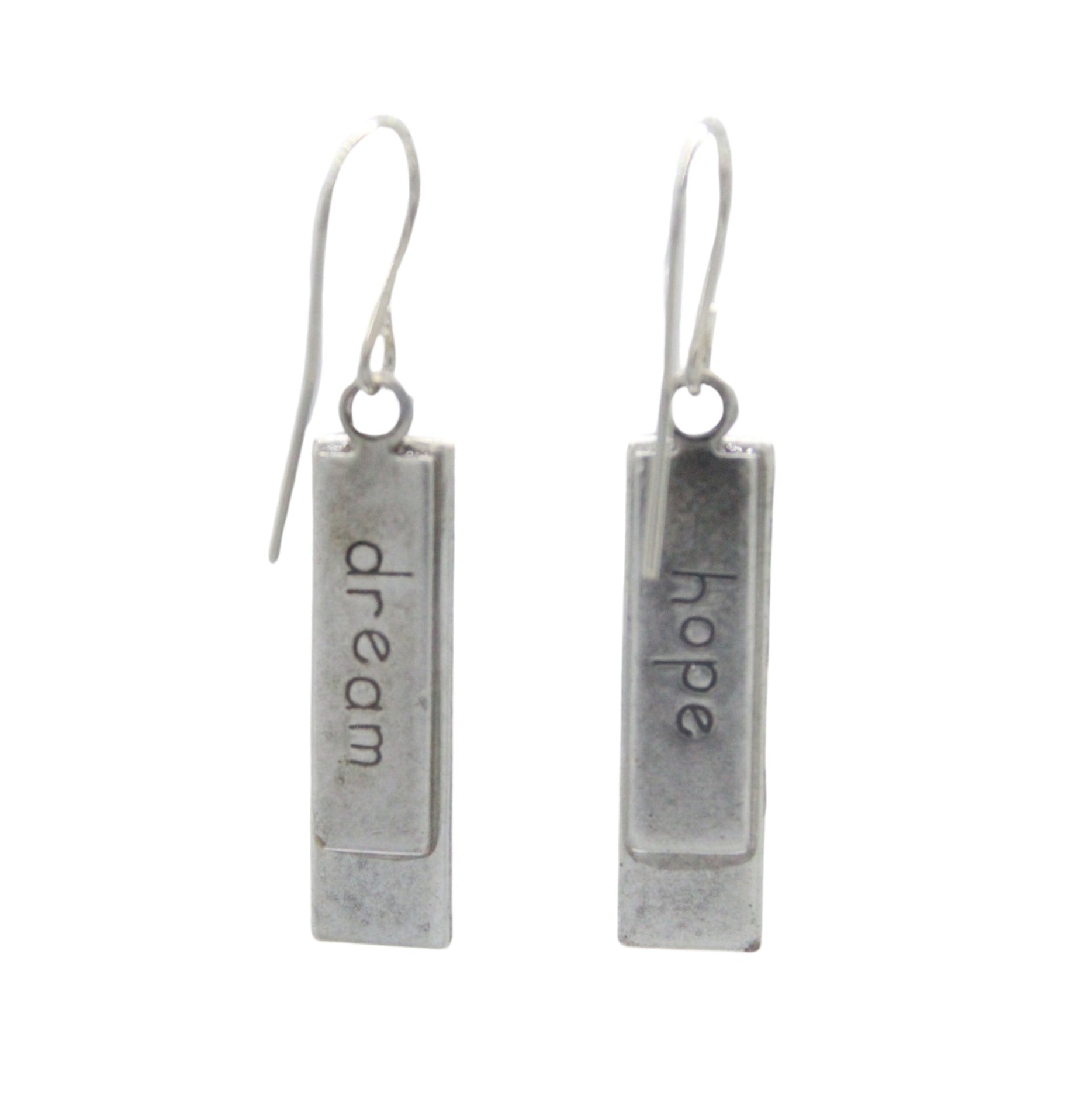 A pair of Beach Glass Rectangle Soft Earrings by Firefly, featuring silver rectangles handmade in Guatemala, each engraved with “dream” or “hope,” hanging from simple hooks against a white background.