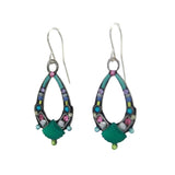 Firefly’s Beach Glass Oval Hoop Soft Earrings feature teal enamel accents, multicolored gemstones, and a seashell motif with silver hooks—handmade jewelry inspired by beach glass.