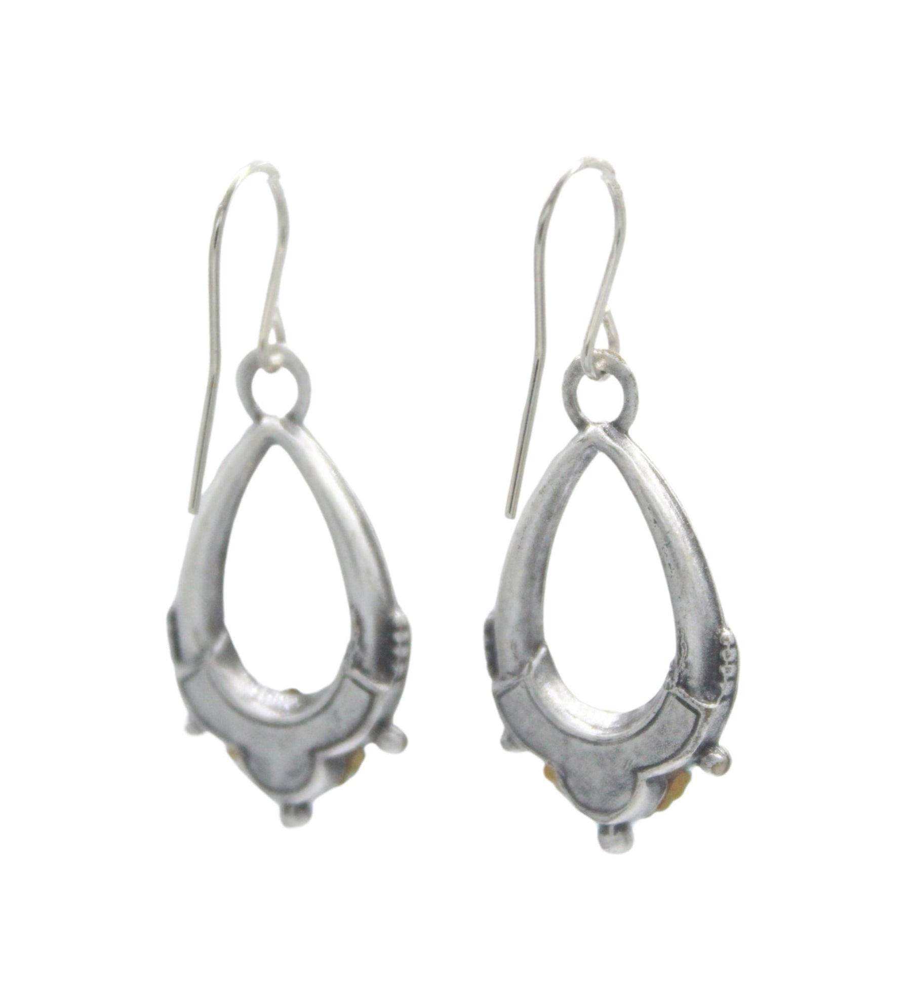 The Beach Glass Oval Hoop Soft Earrings by Firefly feature handmade sterling silver drop designs with subtle detailing and a polished finish, offering timeless elegance in the brand’s signature style.