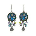 The Firefly Beach Glass Fringe Soft Earrings feature round, colorful floral designs with dangling seashell charms and blue, green, and purple beads—beautifully crafted as fair-trade jewelry.