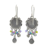 Add coastal flair to any look with Firefly’s Beach Glass Fringe Soft Earrings—silver discs with colorful beads and dangling shell-shaped charms. These handmade earrings by Firefly Jewelry are perfect for a beach-inspired style.