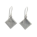 The Beach Glass Simple Diamond Soft Earrings by Firefly feature flat, diamond-shaped pendants on simple hooks—a timeless handmade addition to your jewelry collection.