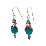 Beach Glass Blue Shell Soft Earrings by Firefly feature teal, pink, green, and pearl-like beads with gold hooks and intricate designs—a vibrant choice for handmade jewelry lovers.