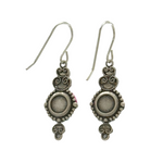The Beach Glass Blue Shell Soft Earrings by Firefly feature antique-style silver dangles with decorative details and a round central element, exemplifying fine handmade jewelry, displayed on a white background.