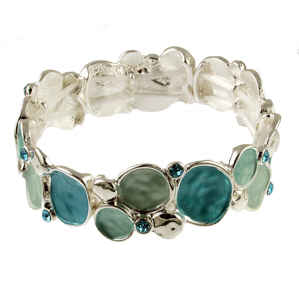 Origin Silver Green-Aqua Bubbles stretch bracelet featuring silver-tone circular links with seafoam and teal enamel inlays and small blue crystals, crafted from mixed jeweler’s metals.