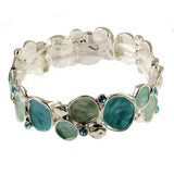 Origin Silver Green-Aqua Bubbles stretch bracelet featuring silver-tone circular links with seafoam and teal enamel inlays and small blue crystals, crafted from mixed jeweler’s metals.