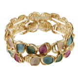 Origin Matte Gold Multi Tone Leaves Bracelet featuring elegant stretch links shaped like leaves, accented with teal, pink, and cream enamel.