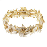 Origin Matte Gold White Flower Stretch Bracelet featuring elegant gold-tone metal flowers with white petals.
