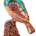 The Kubla Crafts Trinket Box: Bee Catcher Box features vibrant blue, green, and brown hues, sparkling rhinestone accents, detailed feather textures, and sits on a textured brown and orange base.
