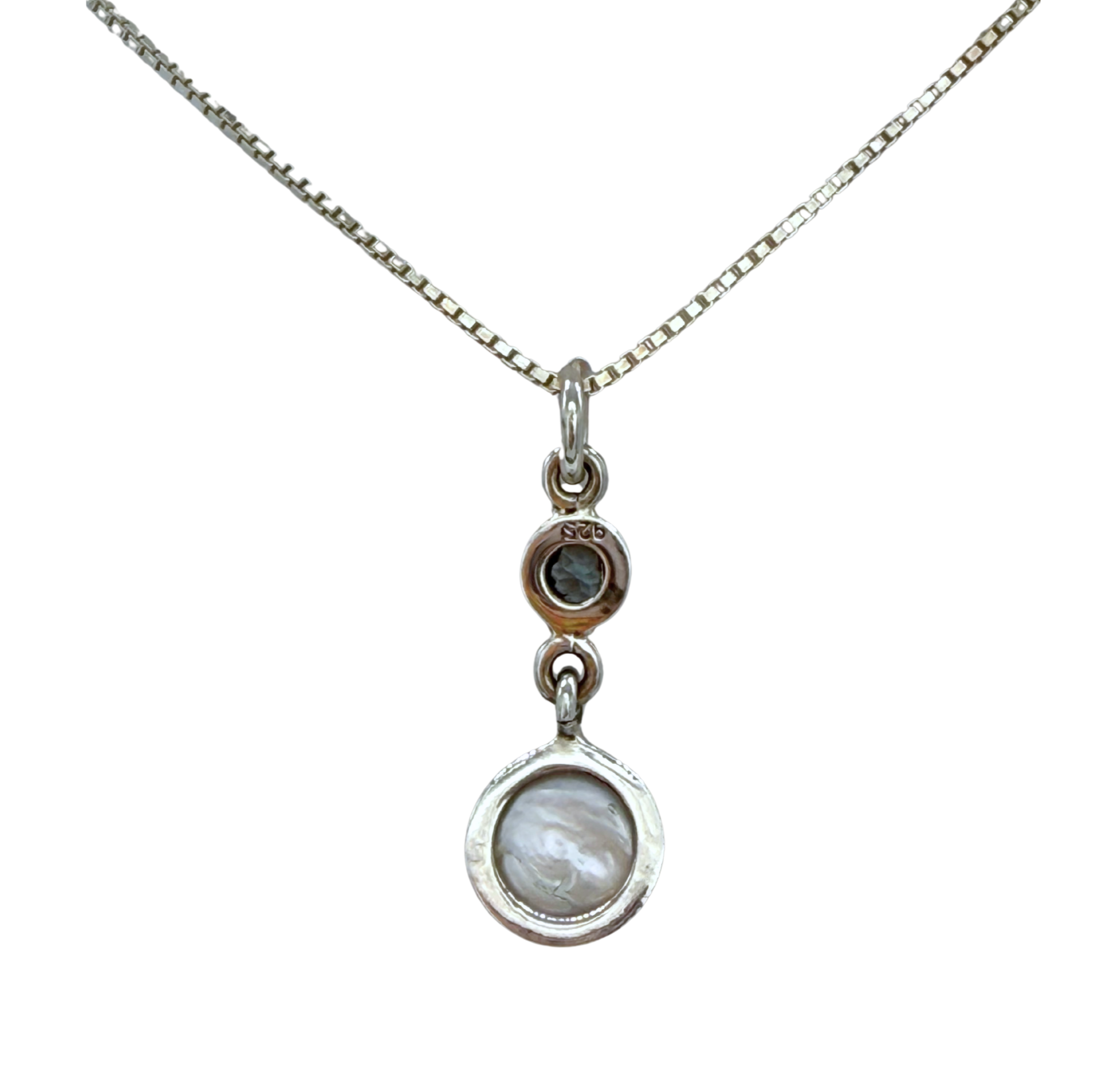 The Freshwater Pearl Round Blue Topaz Necklace by Mediterranean Artists Co. Sterling Silver features a thin 925 silver chain with double pendants: a small round freshwater pearl and a larger marbled blue topaz stone.