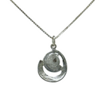 The Sterling Silver Spiral Freshwater Pearl Center Necklace by Mediterranean Artists Co. Sterling Silver features a unique spiral design with a pearl center on a sleek square-link chain.