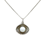The Sterling Silver Freshwater Pearl in Shell Necklace by Mediterranean Artists Co. Sterling Silver features a delicate box chain and an open seashell pendant with a single white freshwater pearl, perfect for lovers of elegant jewelry.
