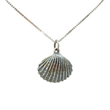 The Sterling Silver Freshwater Pearl in Shell Necklace by Mediterranean Artists Co. Sterling Silver features a scallop shell pendant with a pearl on a square-linked chain—perfect for gifting during our blowout sale.