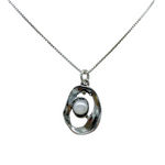 The Mediterranean Artists Co. Sterling Silver Oval Freshwater Pearl in Center Necklace features a 925 silver oval frame with a white pearl centerpiece, designed in an elegant box chain and part of our Freshwater Pearl Necklaces collection.