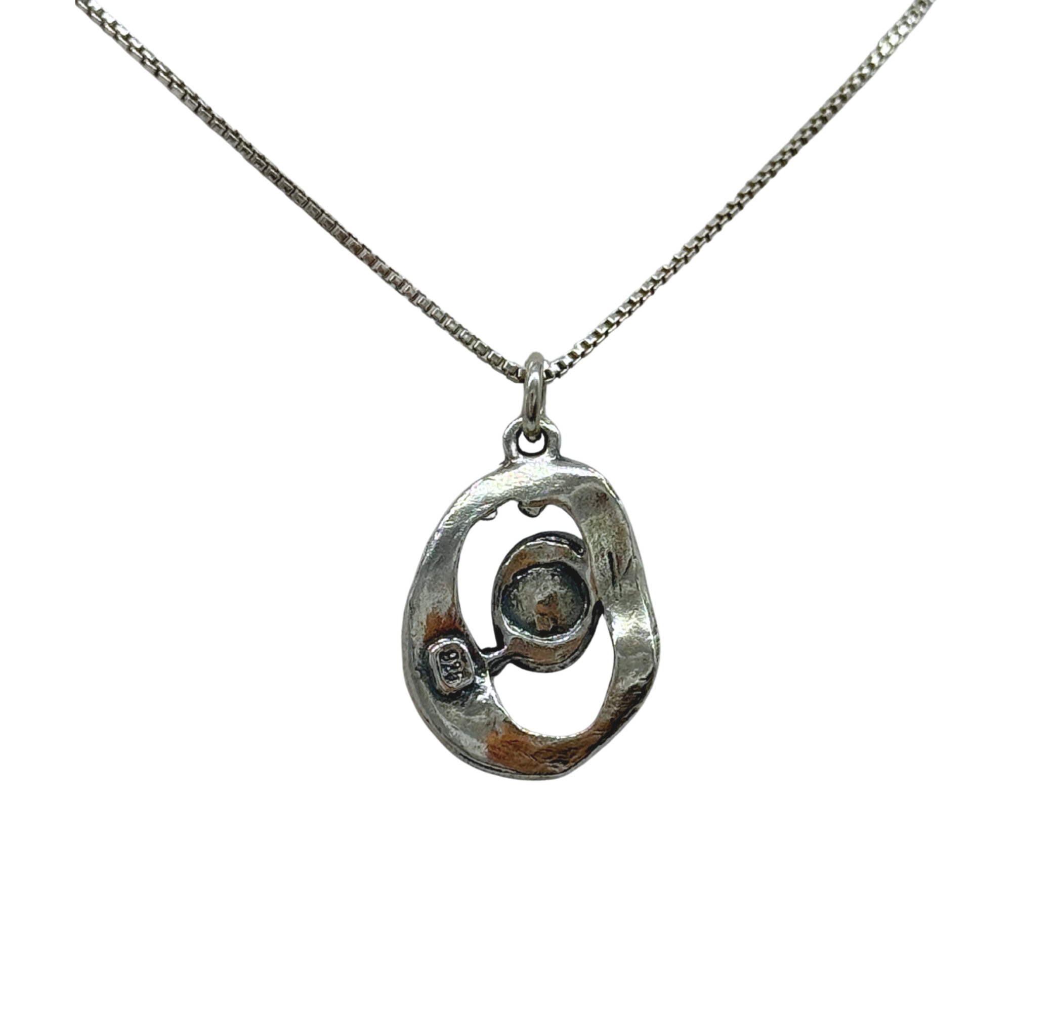 The Mediterranean Artists Co. Sterling Silver Oval Freshwater Pearl in Center Necklace features a 925 sterling silver pendant with an abstract oval charm and pearl accent—now available at our blowout sale.