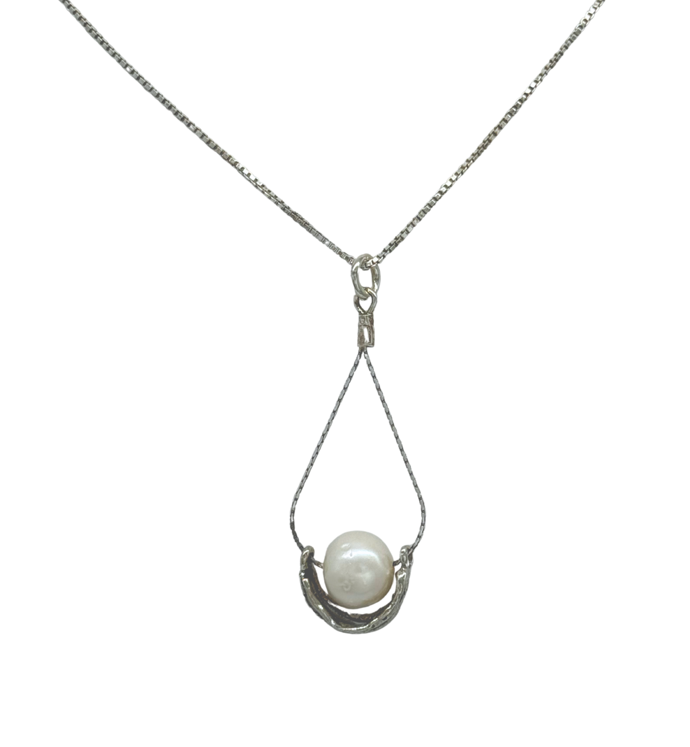 The Sterling Silver Wire Basket Freshwater Necklace by Mediterranean Artists Co. Sterling Silver features a white freshwater pearl in a teardrop wire setting—a perfect choice for freshwater pearl necklace enthusiasts.