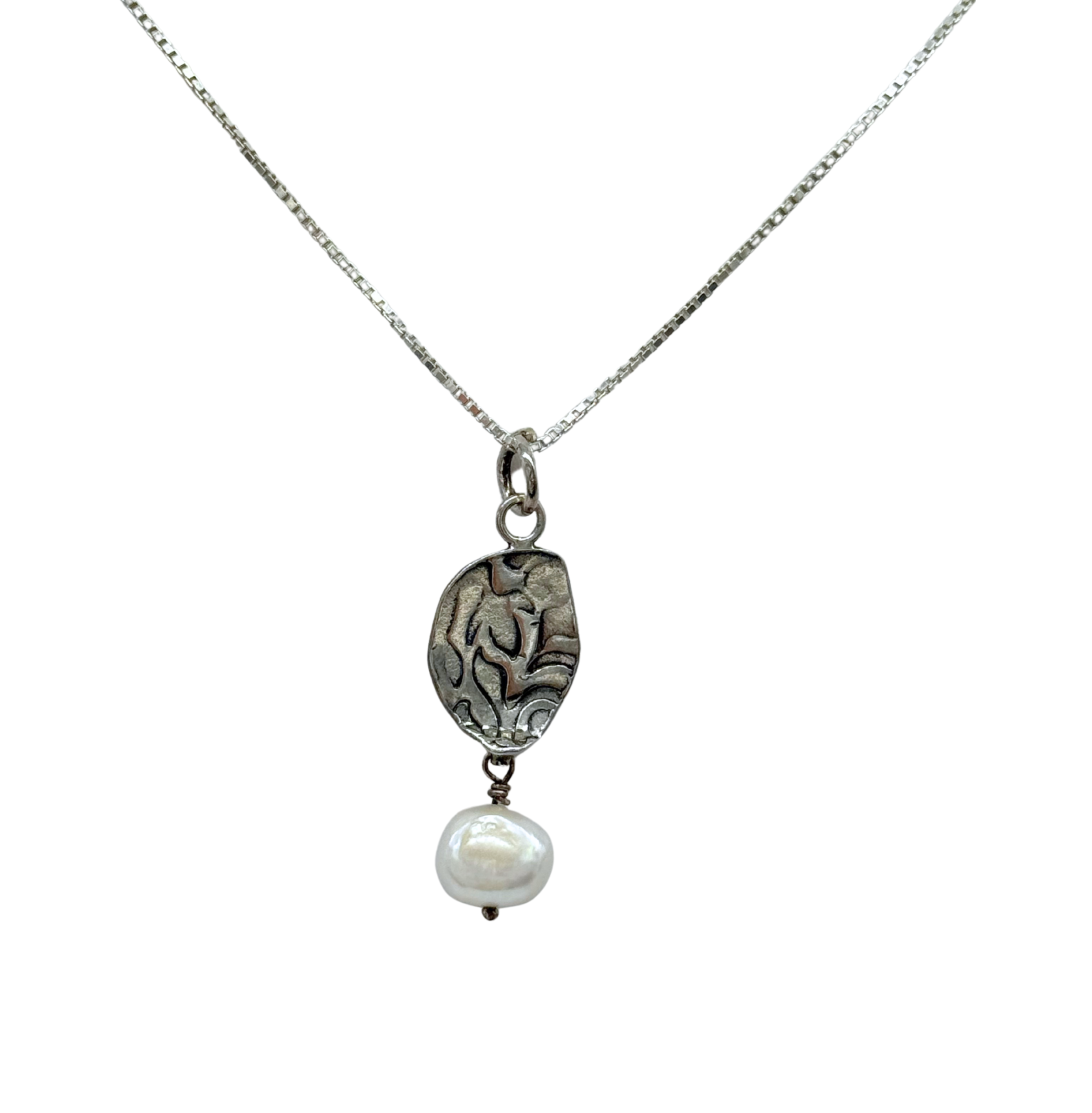 The Sterling Silver Deco Oval Freshwater Pearl Dangle Necklace by Mediterranean Artists Co. Sterling Silver features a textured oval pendant and a white freshwater pearl—elegant and striking in the Freshwater Pearl Necklaces collection.