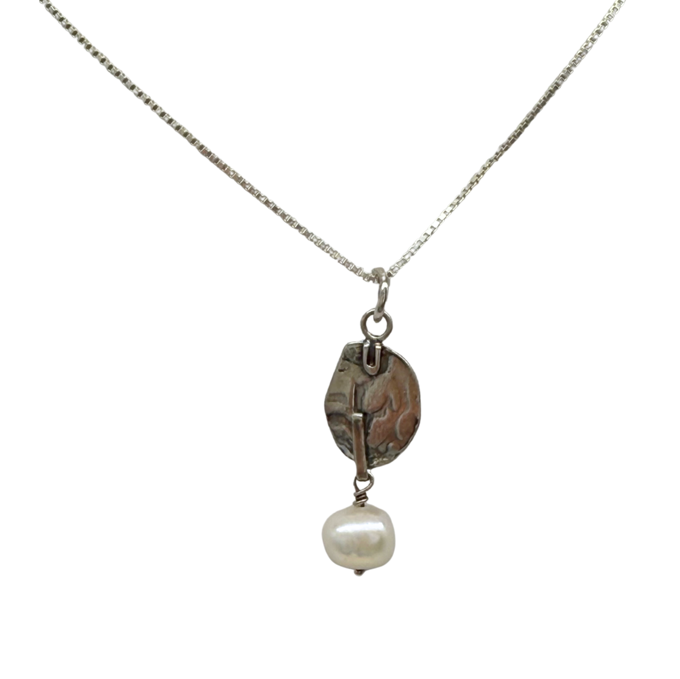 The Sterling Silver Deco Oval Freshwater Pearl Dangle Necklace by Mediterranean Artists Co. Sterling Silver features a rustic pendant with a white pearl—a timeless choice for lovers of Freshwater Pearl Necklaces.