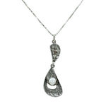 The Sterling Silver 2 Part Freshwater Pearl Necklace by Mediterranean Artists Co. Sterling Silver features an abstract textured pendant with a single round white pearl—ideal for fans of unique Freshwater Pearl Necklaces.