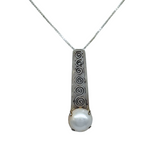 The Mediterranean Artists Co. Sterling Silver White Mabe Pearl Art Deco Necklace features an engraved swirl pendant with a round pearl on a thin chain. Shop elegant freshwater pearl necklaces in our blowout sale.