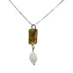 The Gold Plated Rectangle Freshwater Pearl Necklace by Mediterranean Artists Co. Two Tone features a thin silver chain with a gold plated rectangular pendant and a marquise-shaped freshwater pearl, blending classic elegance with modern design.