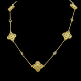 The Be-Je Designs Gold Clovers & CZ Insets Necklace features three clover-shaped pendants with cubic zirconia on a delicate, adjustable 14kt gold chain, adding elegance to any look.