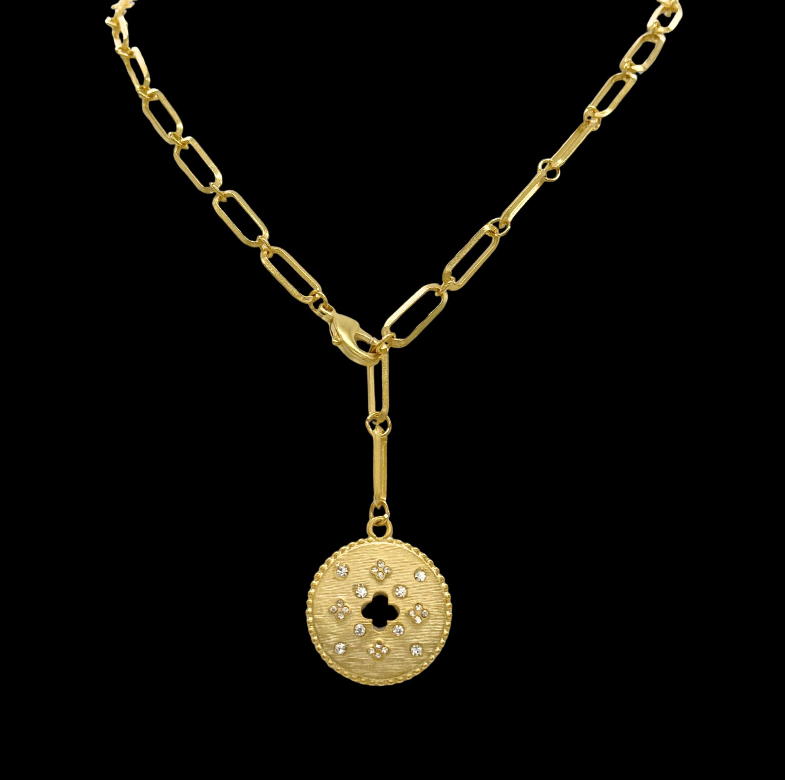 The Be-Je Designs Gold Paperclip w/Pave Flowers & Cutout Cross on Round Disc Necklace features 14kt gold elongated links and a round pendant with pave flowers and a cutout cross, making it stand out beautifully.