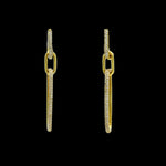 The Be-Je Designs Gold Pave CZ Double Link Earrings feature elongated 14kt gold rectangular links embellished with clear cubic zirconia, shown against a black background.