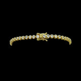 The Be-Je Designs Gold & Clear CZ Tennis Bracelet features a single row of sparkling round cubic zirconia set in 14kt gold, beautifully displayed on a black background.