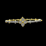 Be-Je Designs' Gold Pave Clover CZS Bracelet features a central clover design encrusted with sparkling stones and additional accents along the band—a chic, everyday accessory that stands out against a black background.