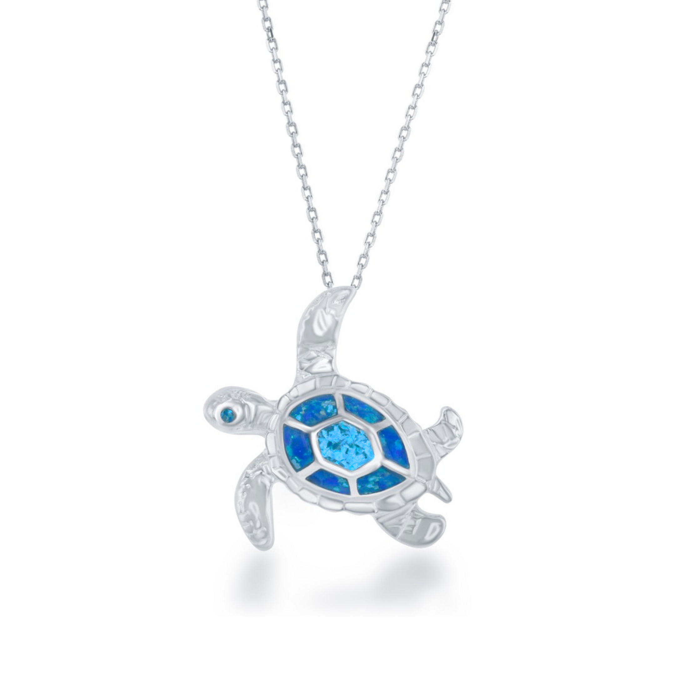 The Classic of New York Caribbean Opal Inlay Turtle Necklace features a sterling silver sea turtle pendant with a blue and turquoise mosaic shell and rhodium plating, elegantly suspended from a delicate chain.