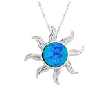 The Classic of New York Caribbean Opal Inlay Sun Pendant features a sterling silver sun-shaped design with a blue-green opal centerpiece on a delicate chain.