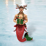 The Rudy Ornament from December Diamonds features a festive merman with red scales, an antler headband, and a red nose, holding a gift. He wears a green and red striped scarf, set against shimmering water—perfect for your holiday decor.