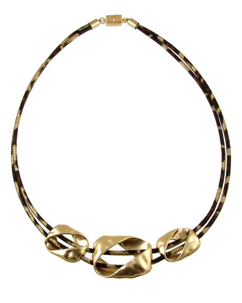 Origin Light Matte Gold Leopard Print Necklace featuring two leopard print cords and three asymmetrical matte gold charms with a magnetic closure.