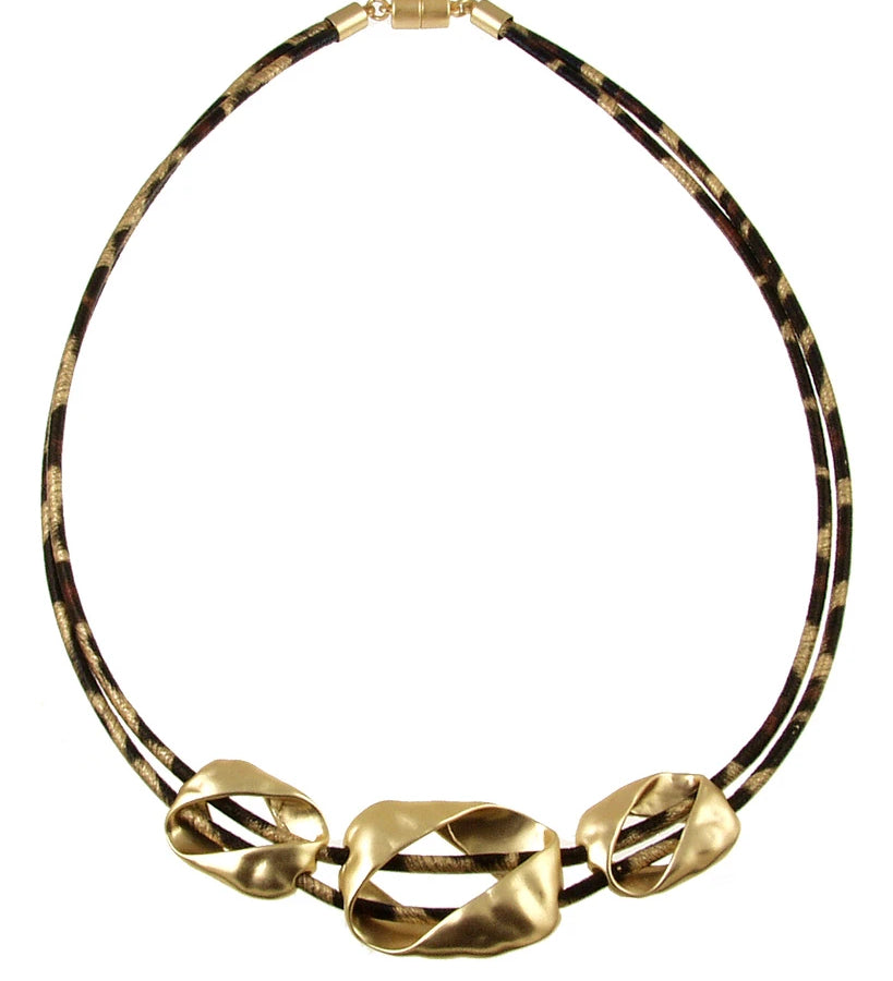 Origin Light Matte Gold Leopard Print Necklace featuring two leopard print cords and three asymmetrical matte gold charms with a magnetic closure.