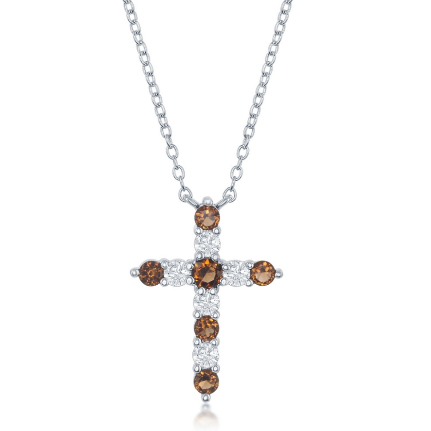 The Classic of New York Sterling Silver Birthstone Cross (January) Necklace features a cross pendant with alternating brown and clear gemstones, displayed against a plain white background.