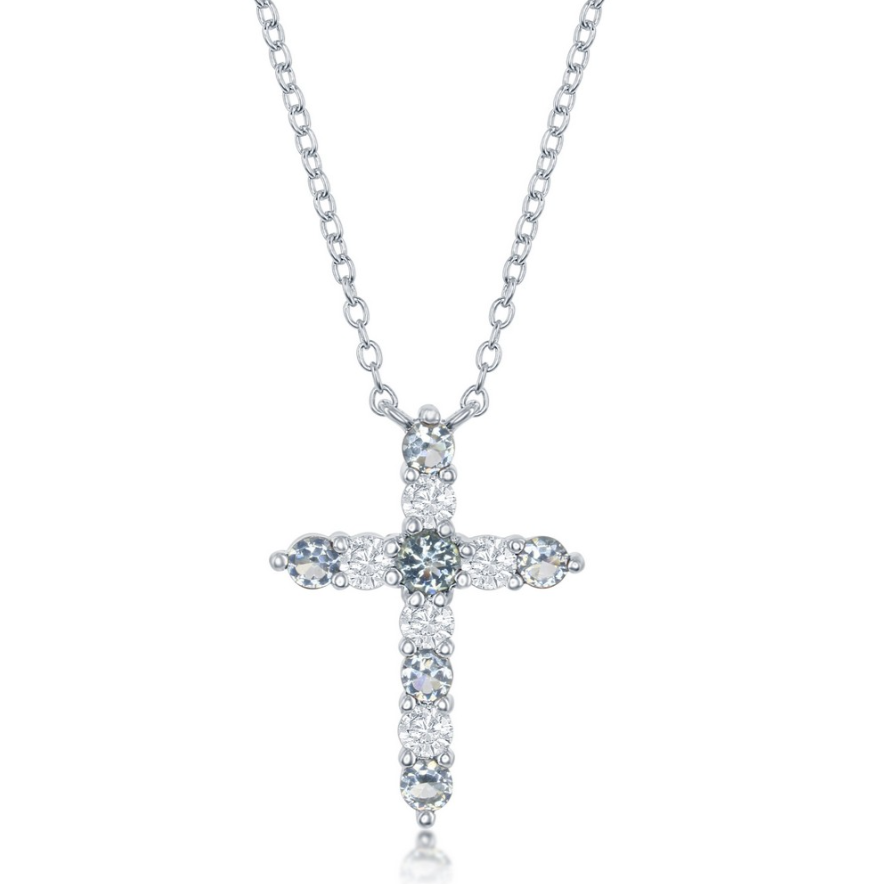 The Classic of New York Sterling Silver Birthstone Cross (March) Necklace features a sparkling white gemstone-encrusted cross pendant, perfect as March birthstone jewelry. Shown on a white background.
