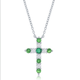 The Classic of New York Sterling Silver Birthstone Cross (May) Necklace features alternating round green and clear stones, making it an elegant emerald or May birthstone jewelry piece, shown on a white background.