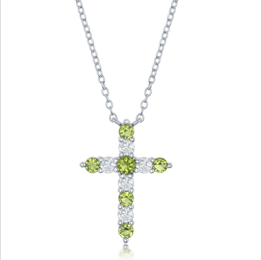 The Classic of New York Sterling Silver Birthstone Cross (August) Necklace features alternating round peridot and clear stones in a cross pendant, shown against a white background.