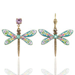 Brite Bloom Cascade Bouquet Dragonfly Crystal Dangle Earrings by Anne Koplik Designs, Inc. feature colorful enamel wings, floral accents, gold-toned bodies, and mismatched studs—a purple gem on one and a gold hook. Handmade rainbow jewelry in the USA.