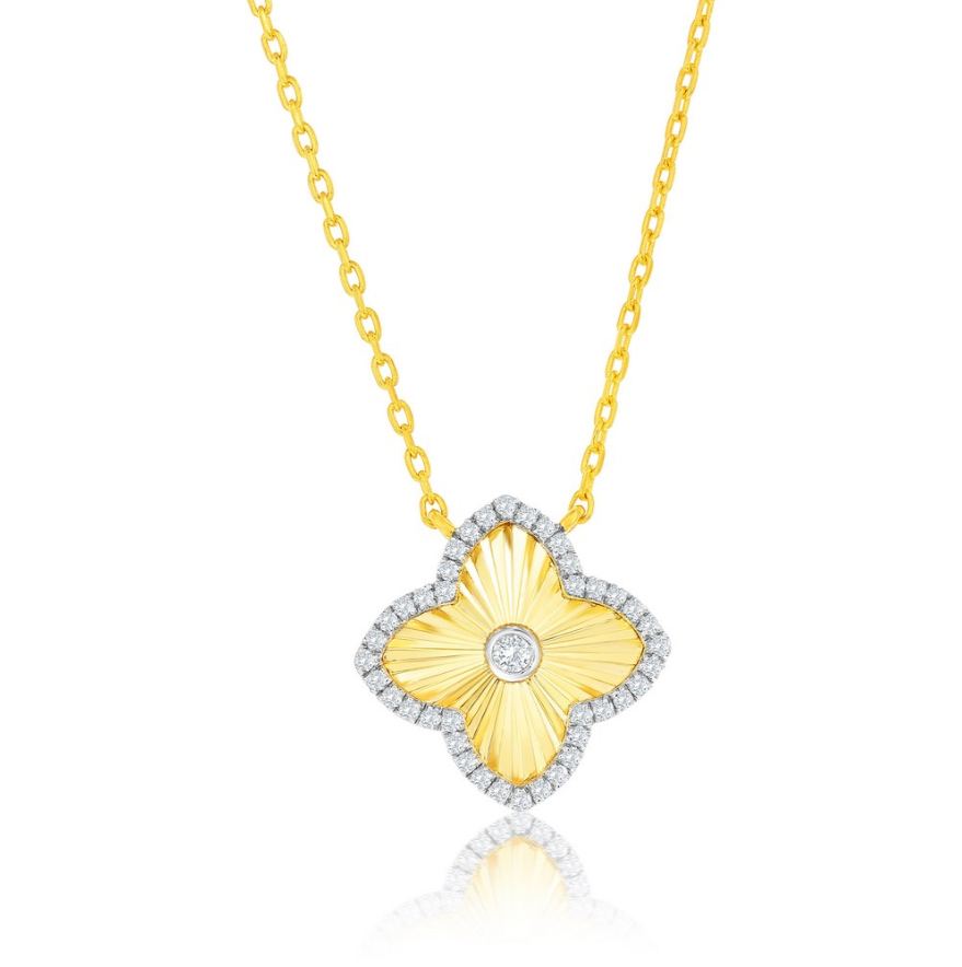 The Gold Plated Clover CZ Outline Necklace by Classic of New York features a clover-shaped yellow pendant with a textured finish, CZ accents along the edge, and a central round diamond.